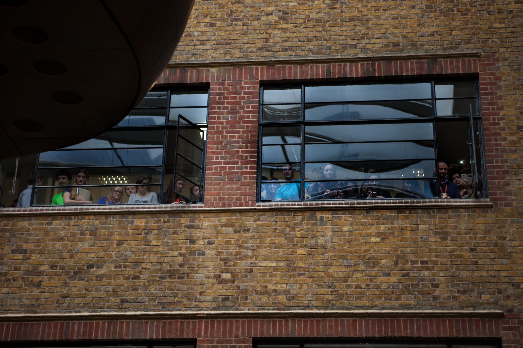 Crowds looking on from the internal windows