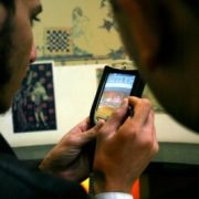 smart phone being used to research information in a museum