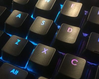 Close up of illuminated keys of a computer keyboard.